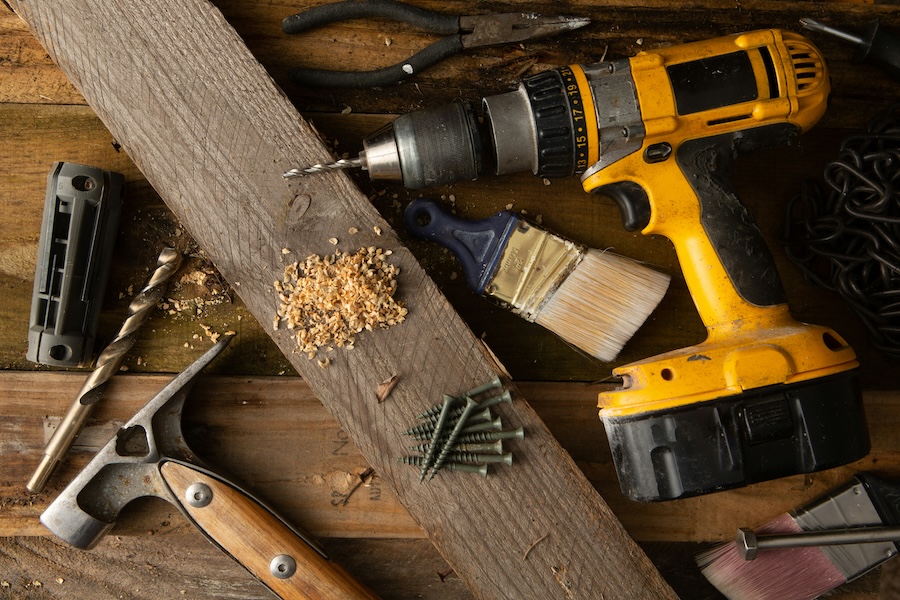 Photo of Construction tools on wooden background by Bermix Studio from Unsplash